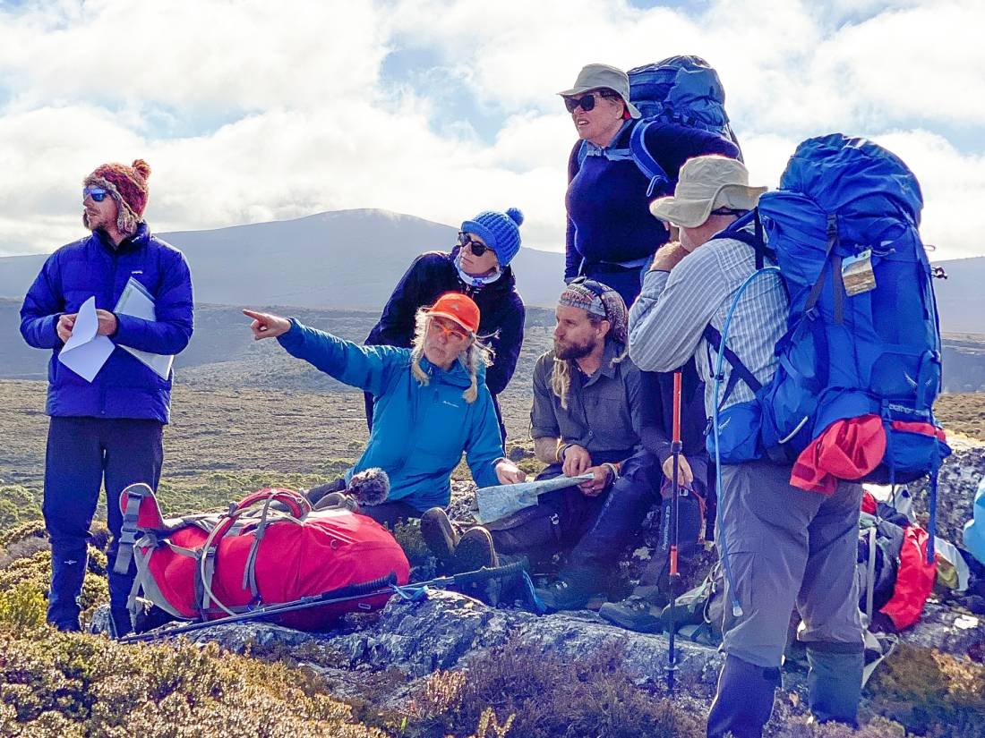 Caro points out features with students on the Overland Track |  <i>Andrew Ford</i>
